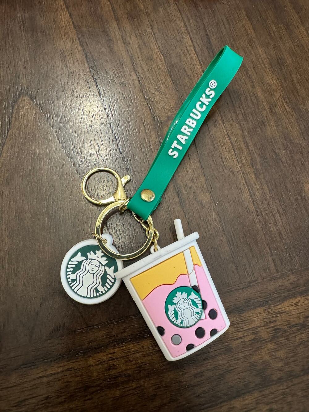 Starbucks bubble tea keychain with pink drink and black tapioca pearls